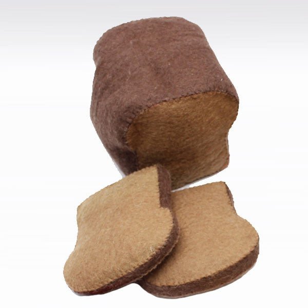 Felted bread loaf and slices on a white background