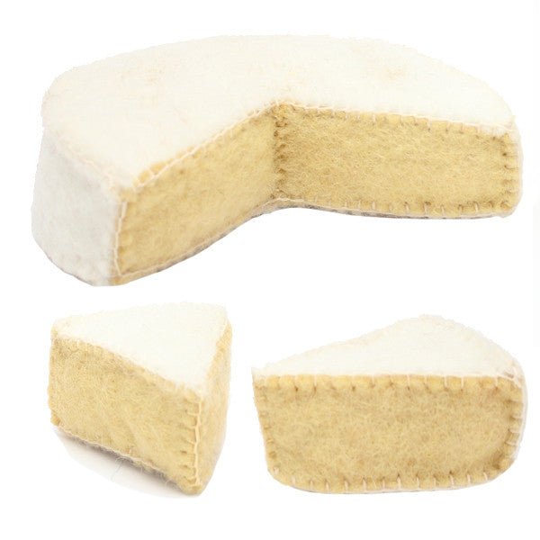 Partial wheel of felted camembert cheese and 2 wedges on a white background