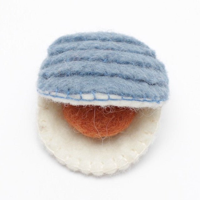Felted clam on a white background