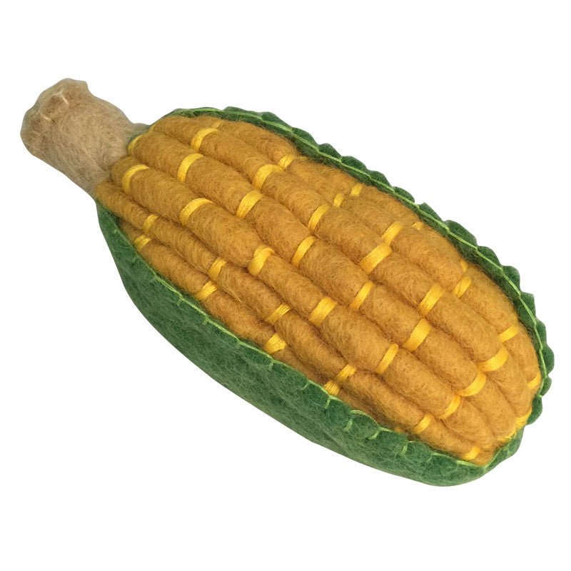 felted corn on a white background