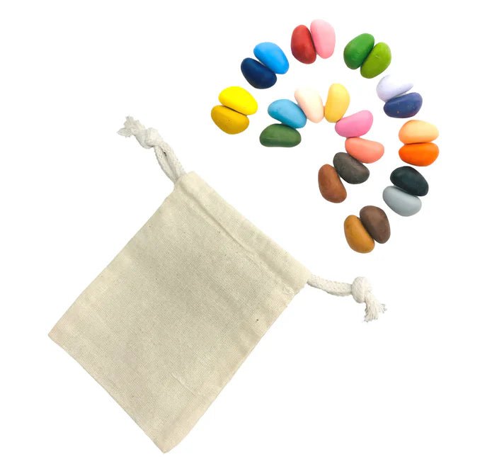 Muslin drawstring bag with colorful crayon rocks on a white background