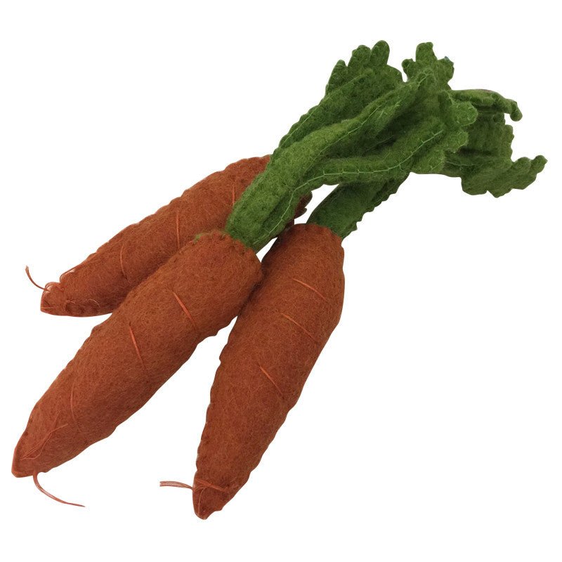3 felted dutch carrots on a white background