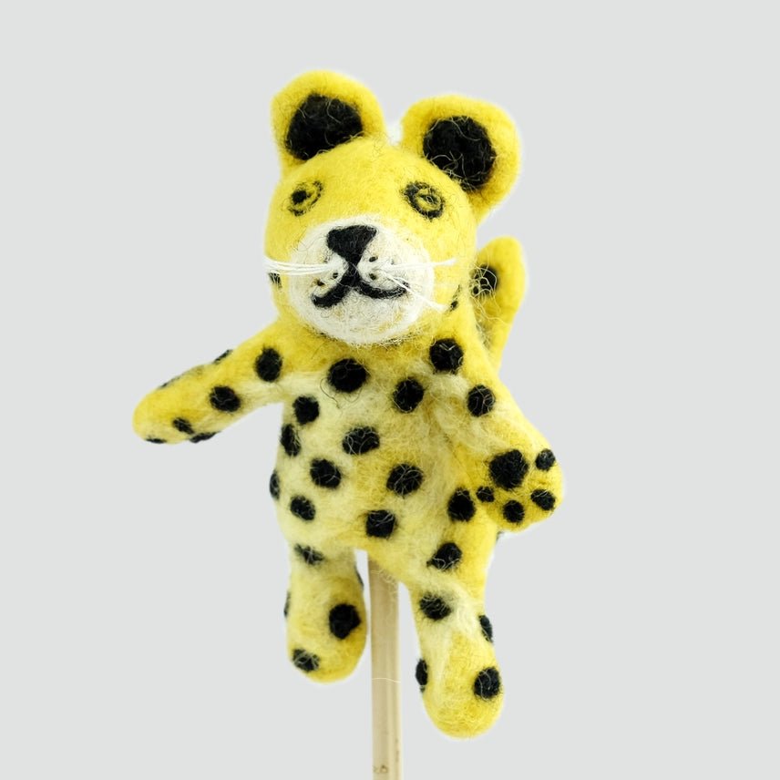 Felt leopard finger puppet on a white background