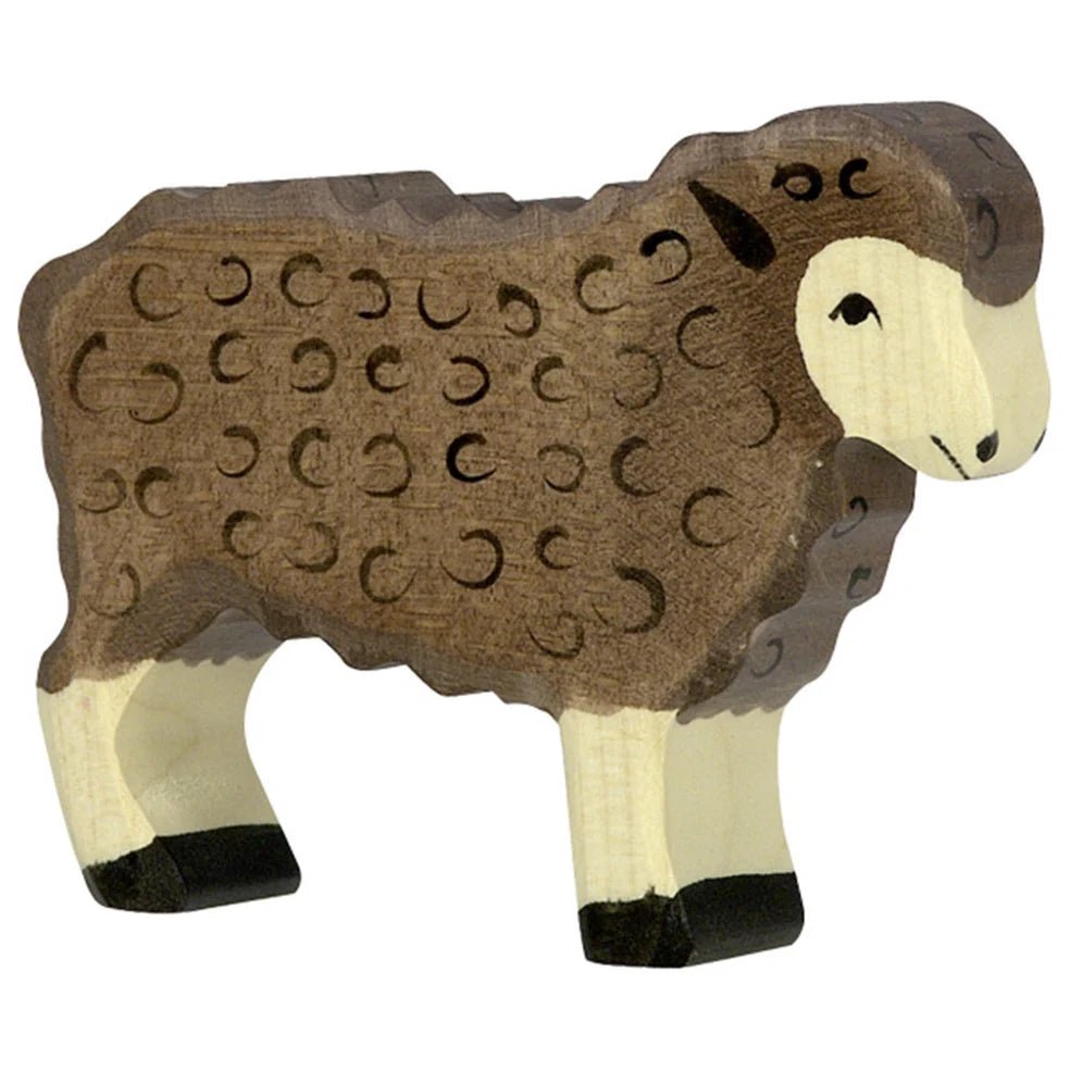 Wooden sheep figure with brown wool on a white background