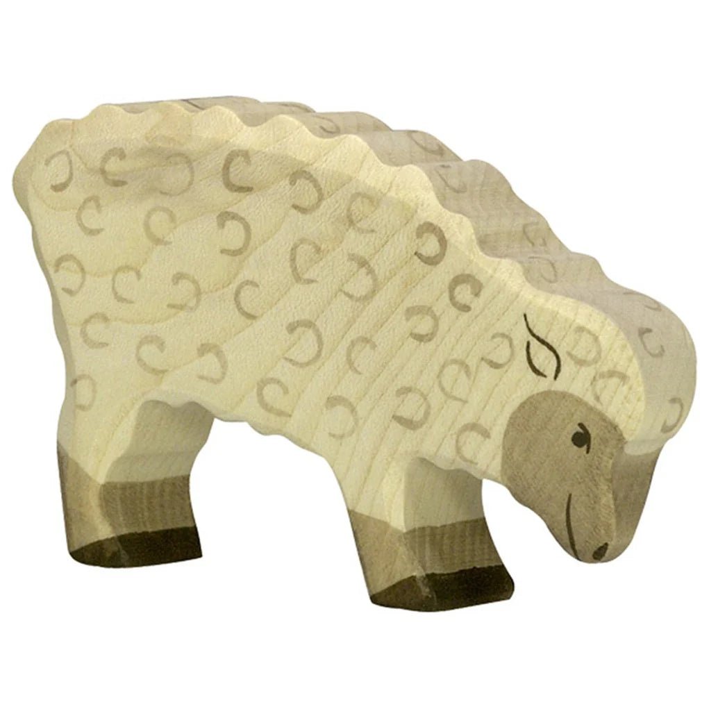 Wooden sheep figure with a textured pattern on a white background