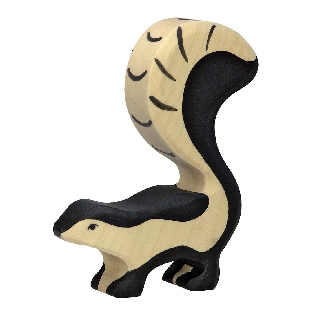 Wooden skunk figure on a white background