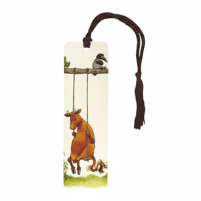 Bookmark with illustration of a cow and bird on a swing against a white background