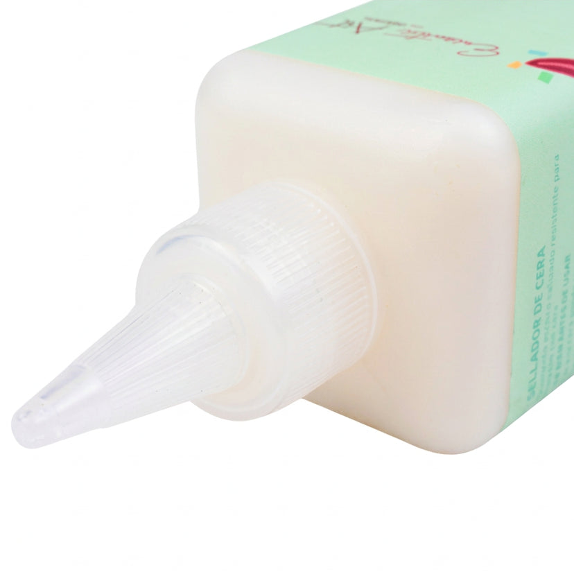 Close up view of pointed plastic tip of wax sealer bottle