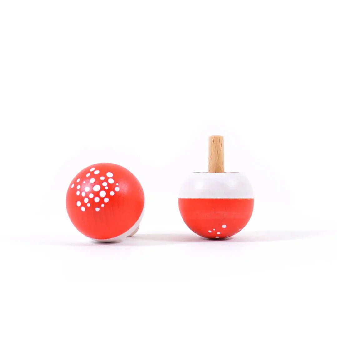 Two red and white spotted mushroom tops on a white background