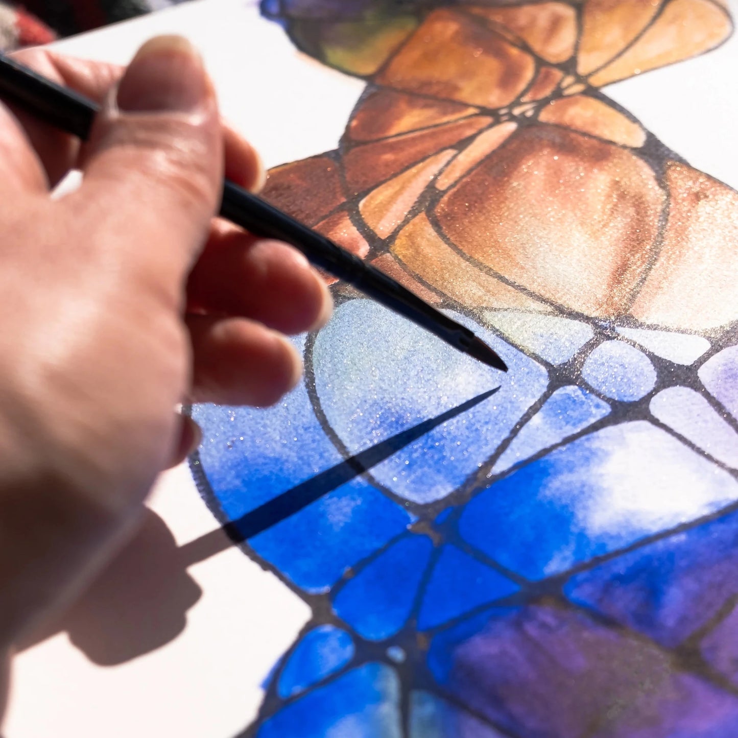 Hand painting a watercolor painting on a white canvas