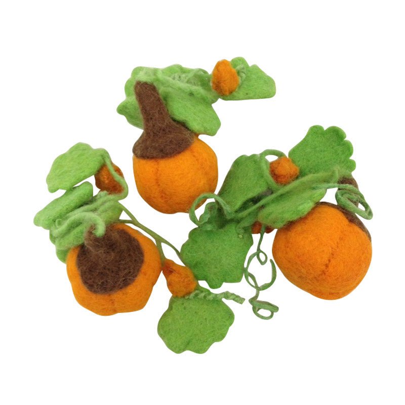 3 felted pumpkins w/ vines on a white background