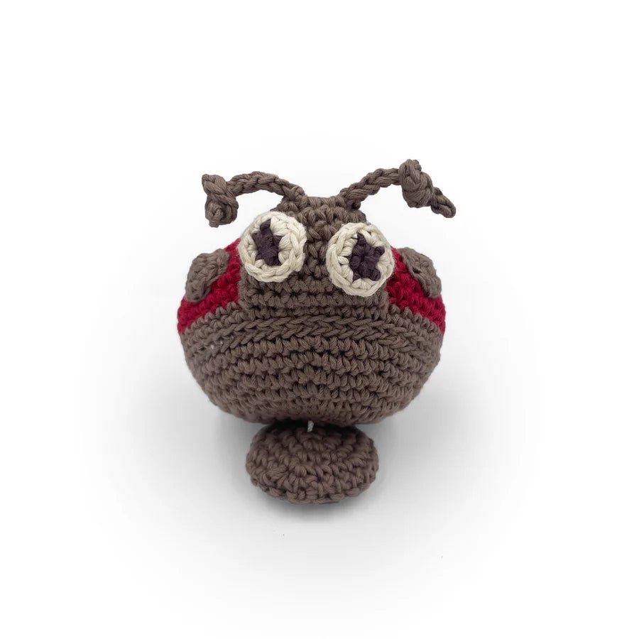 Crocheted ladybug toy with red and grey accents on a white background