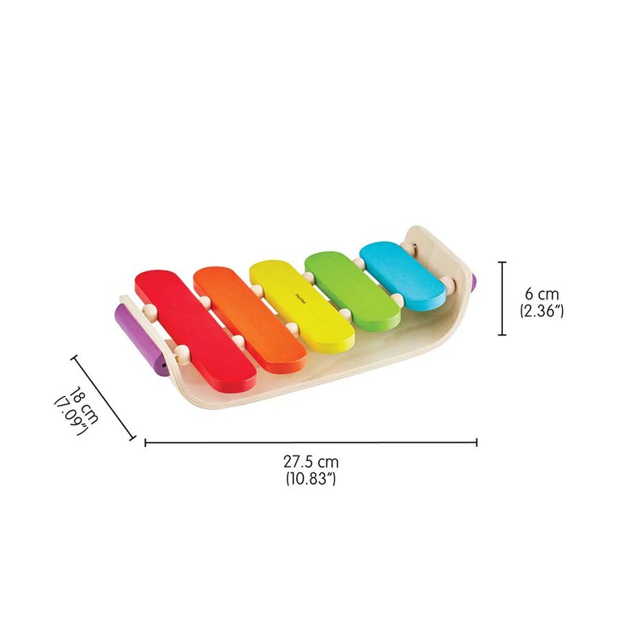 Colorful wooden xylophone with measurements on a white background