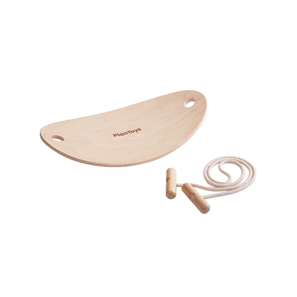 Wooden seesaw toy with a rope, branded 'Plan Toys', on a white background