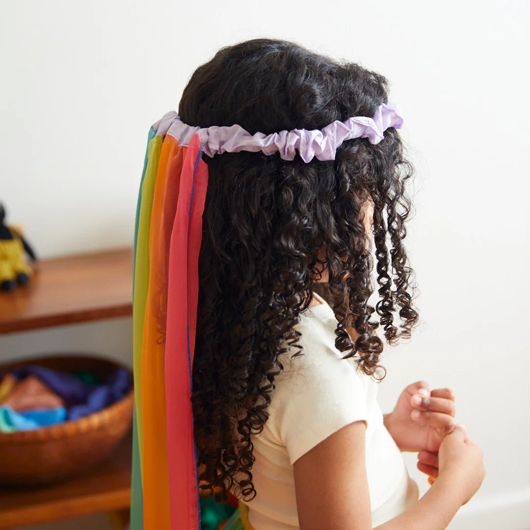 Child with rainbow veil
