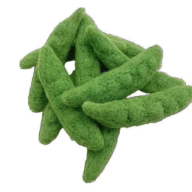 12 felted snow peas on a white background