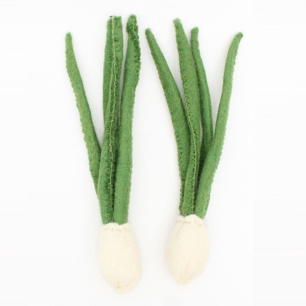 2 felted spring onions on a white background