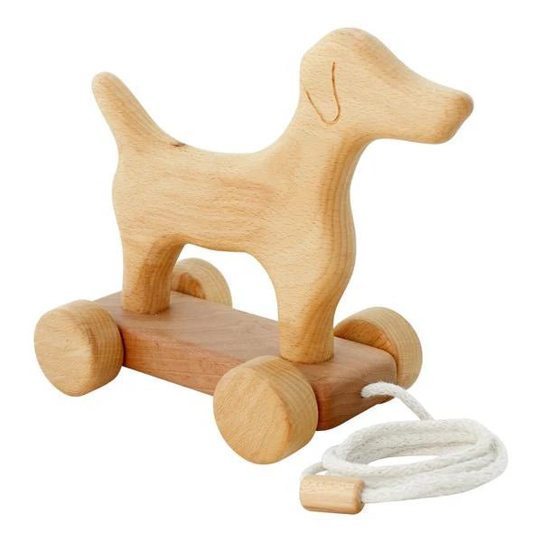 45 degree view of wooden dog-shaped pull toy with wheels on a white background