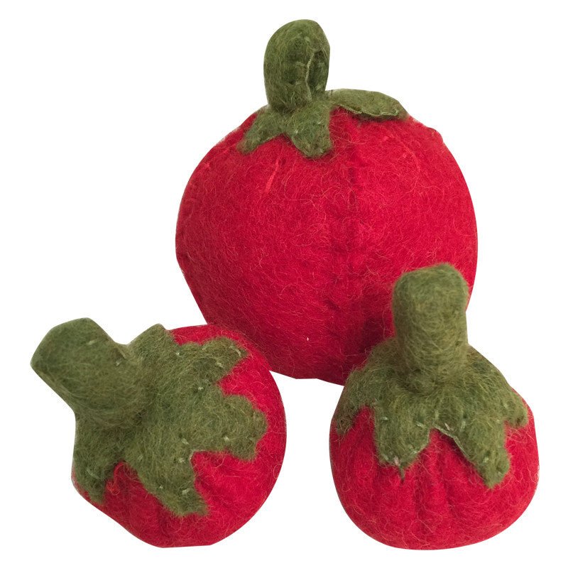3 felted tomatoes on a white background