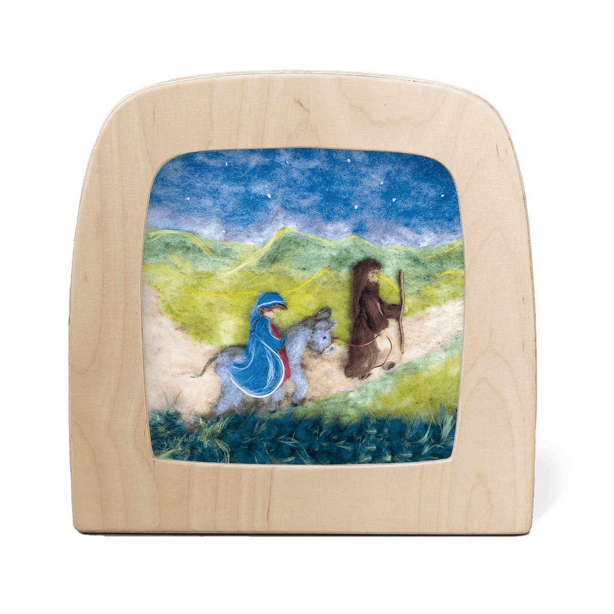 Silhouette of Joseph leading Mary on a donkey