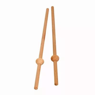 Pair of wooden ring toss sticks on a white background