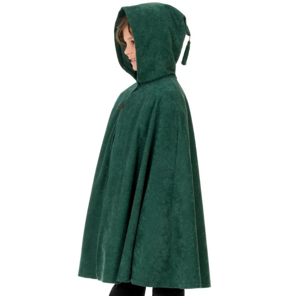 Child wearing a green hooded cape on a white background