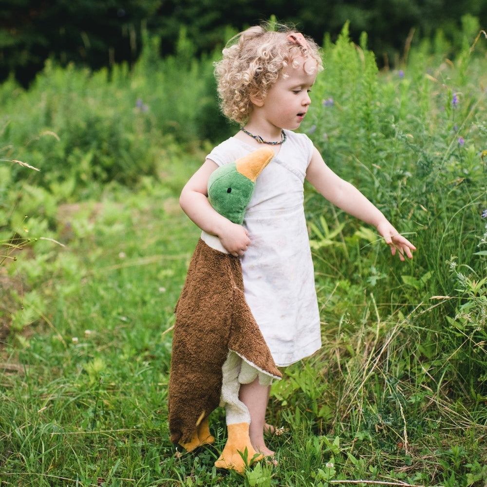 Girl walking in the field with an organic cotton drake by senger