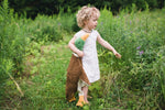 Girl walking in the field with an organic cotton drake by senger