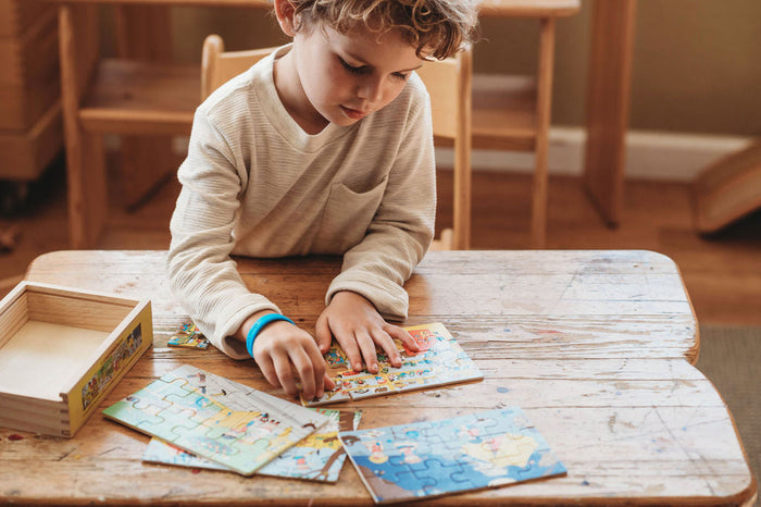 Boy solving a puzzle