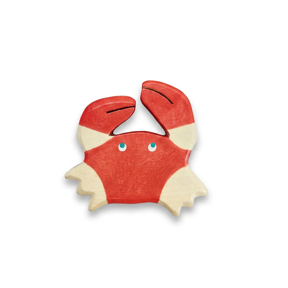 Wooden toy crab figure on a white background