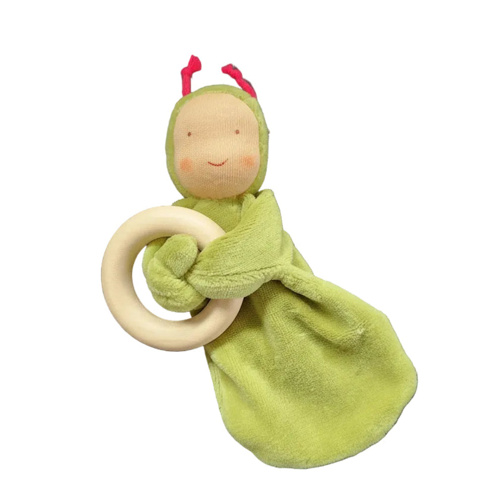 A green plush baby lovey security blanket with a wooden ring teether and a smiling face on a white background