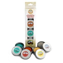 Natural Earth Paint eco-friendly cosmetic glitter in a box with tins of glitter in front on a white background