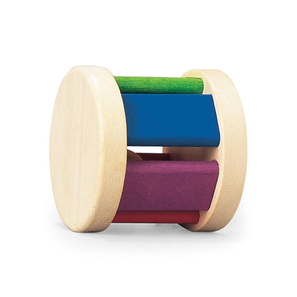 Wooden roller toy with green, blue, purple, and pink panels on a white background