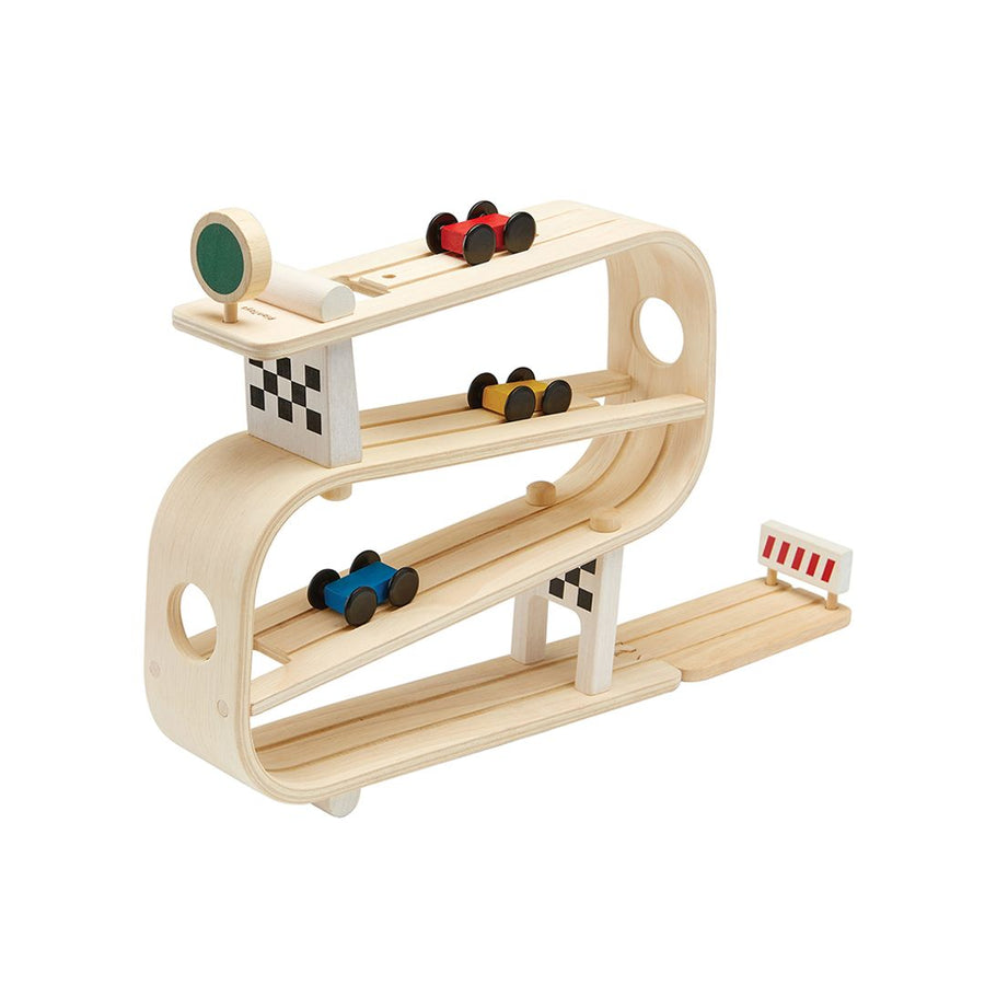 Wooden vertical race track ramp with a red, yellow, and blue car on a white background