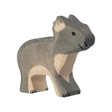 Wooden koala toy figure on a white background