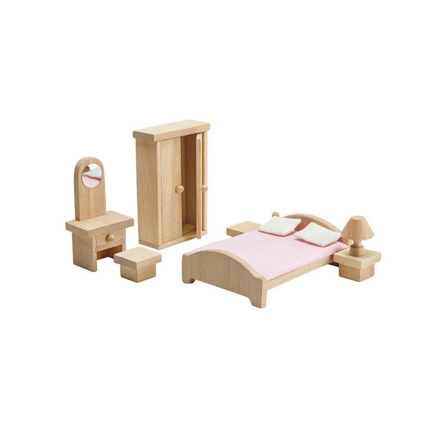 Dolllhouse bedroom furniture on a white background including vanity, stool, closet with door open, bed, 2 side tables, and a lamp