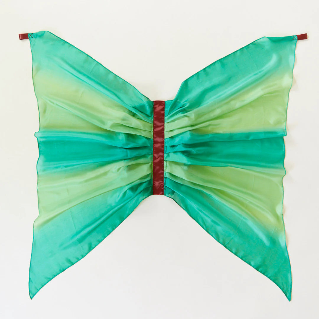 Green silk fairy wings on a white background