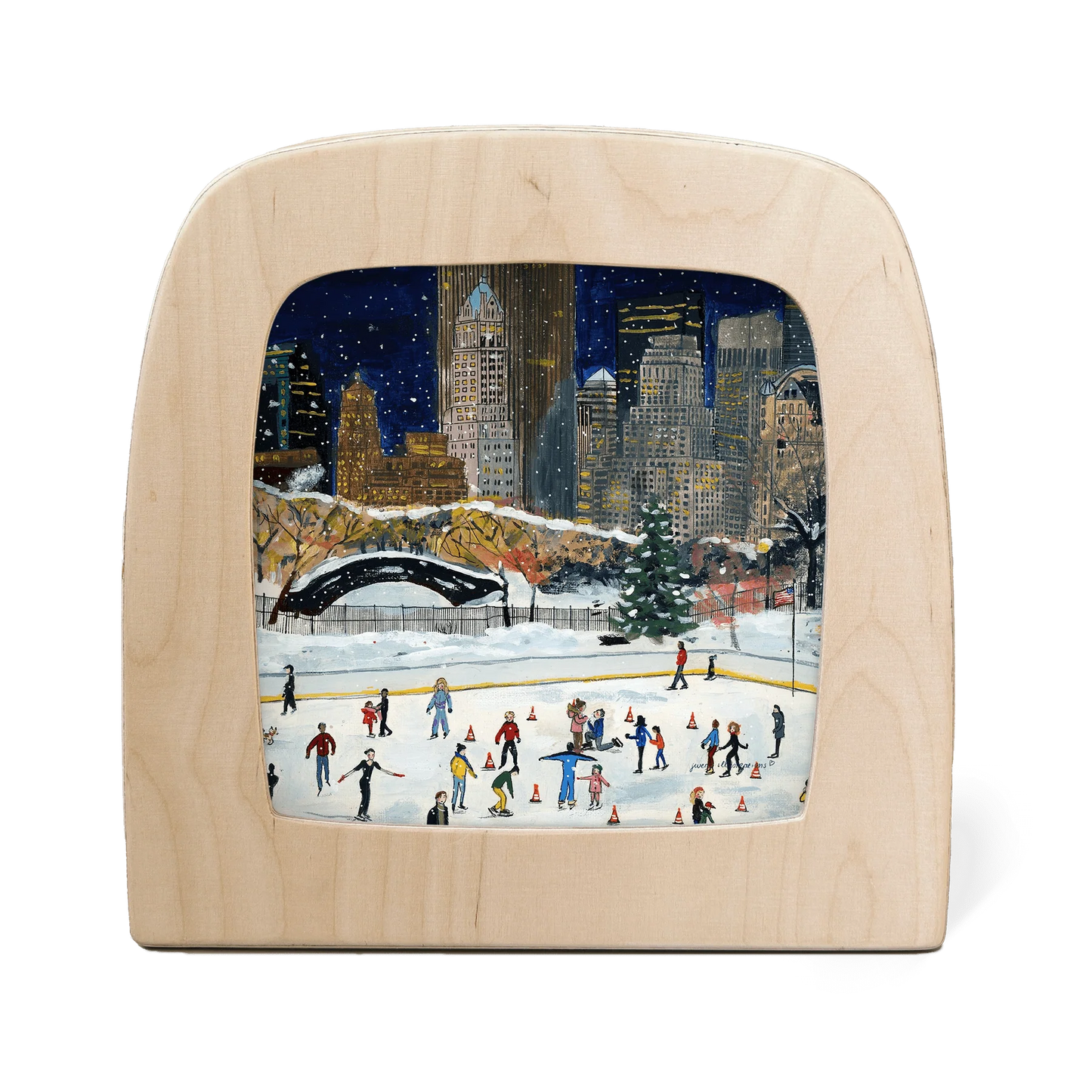 Wooden frame with silhouette of a New York cityscape in winter with people ice skating below