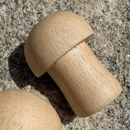 Wooden mushroom-shaped shaker on a textured surface