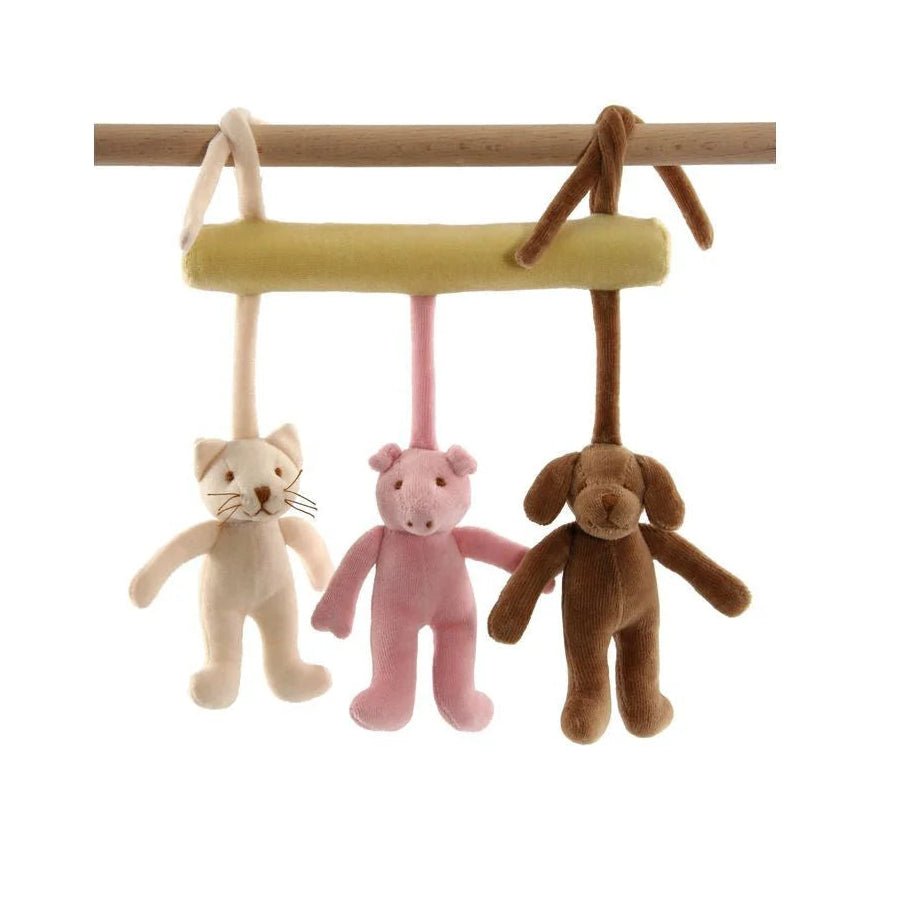 Plush animal mobilehanging from a wooden bar on a white background