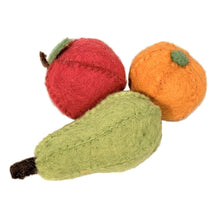 Felted pear, orange, and apple on a white background