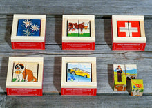 Six different puzzle images of Swiss items.