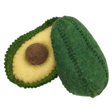 Two halves of a felted avocado on a white background