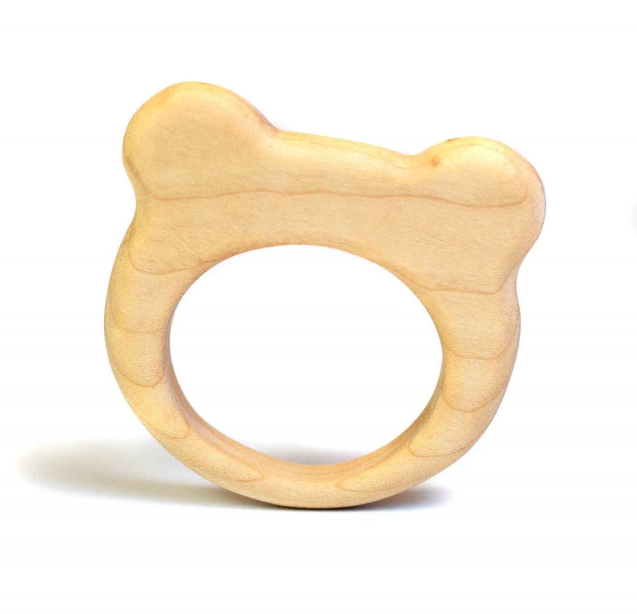 Wooden teether shaped like a bear's head on a white background
