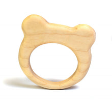 Wooden teether shaped like a bear's head on a white background