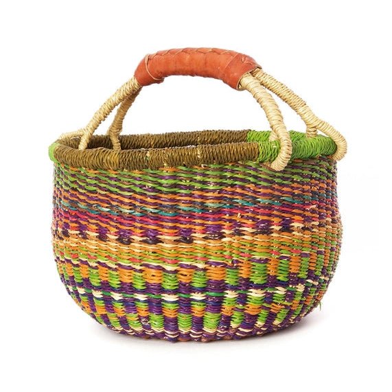 Multicolored woven basket with a handle on a white background