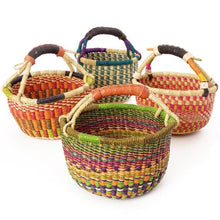 Set of colorful woven baskets with handles on a white background