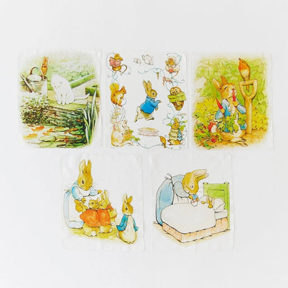 Set of mini playsilks featuring illustrations from Beatrix Potter on a white background.