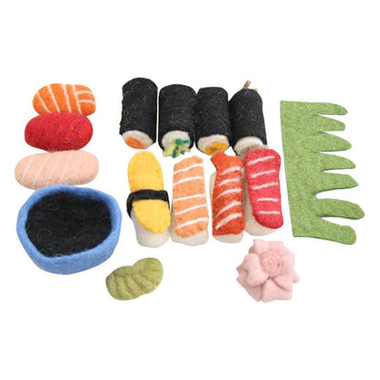 Variety of felted sushi, wasabi, ginger, and soy sauce on a white background