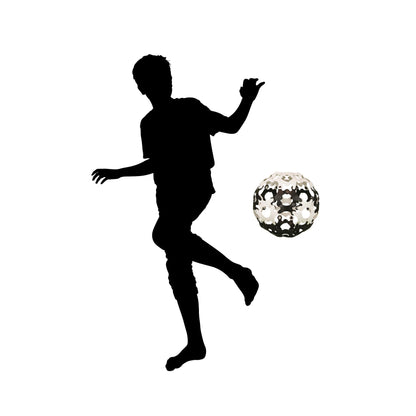 Black silhouette of a person kicking a black and white ball made from Binabo chips on a white background
